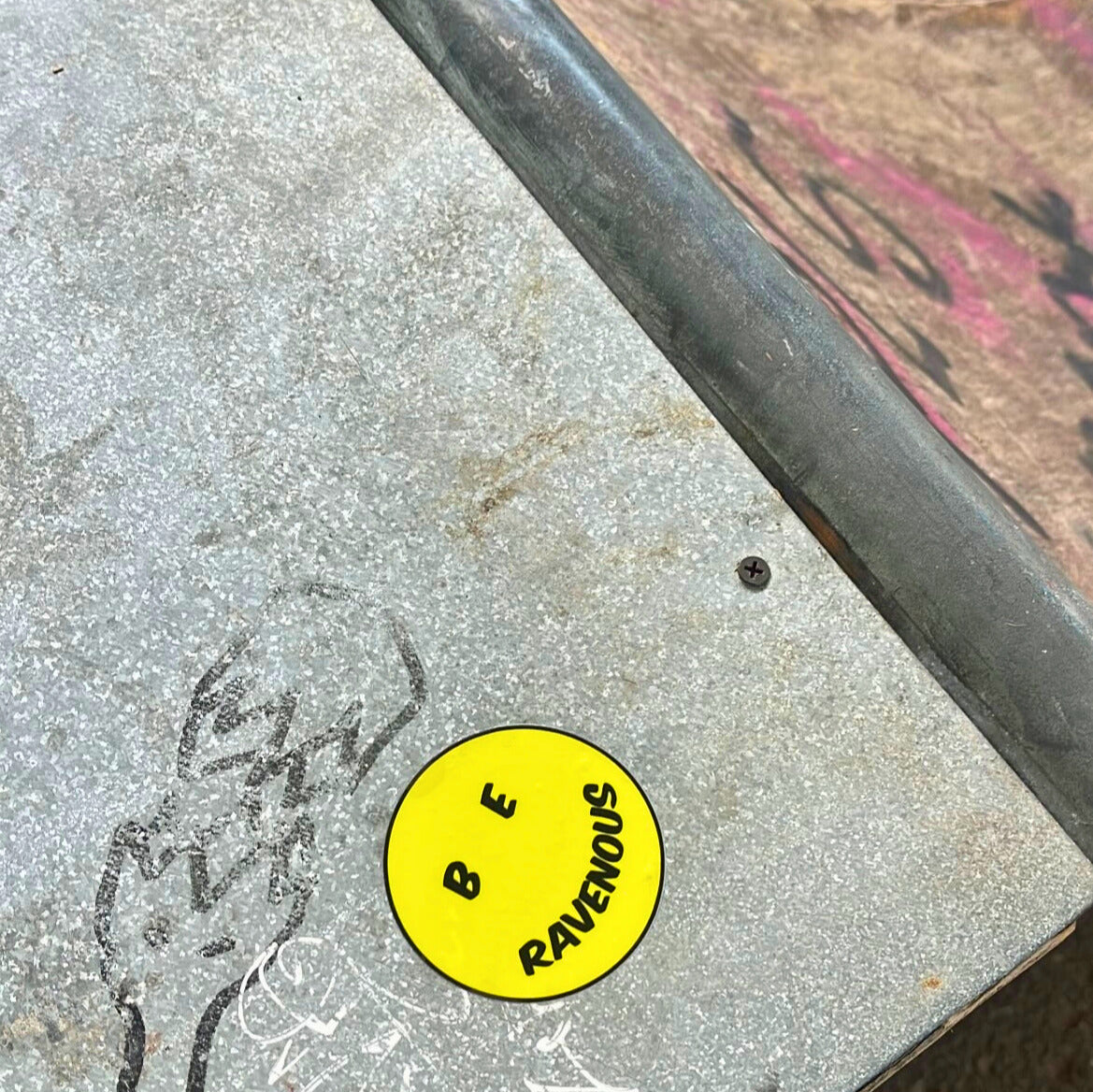 Yellow sticker with text on a textured surface
